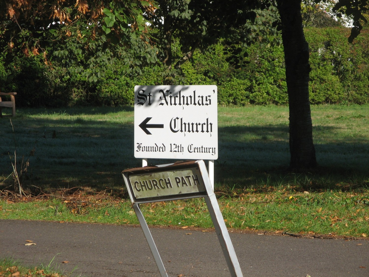 Church Path sign beside the sign pointing to St Nicholas’ Church in Newnham