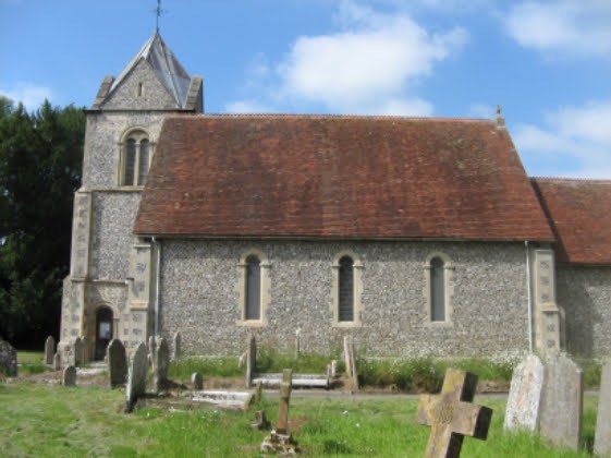 St Nicholas’ Church in Newnham, with its flint walls and churchyard